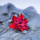 Елегантна брошка коледна звезда в цветовете на фоднацията