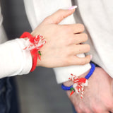 Мартеница за ръка с вълнена цветна прежда и стъклена люта чушчица