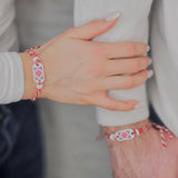 Мартеница за ръка с мотив шевица с бели и червени мъниста - малка