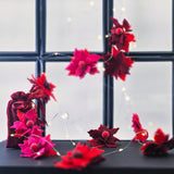 LED гирлянда с филцови цветя в червено, цикламено и бордо